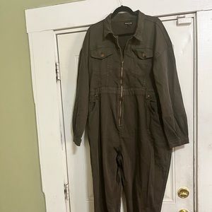 The jumpsuit is brown and has never been worn it is a size 24